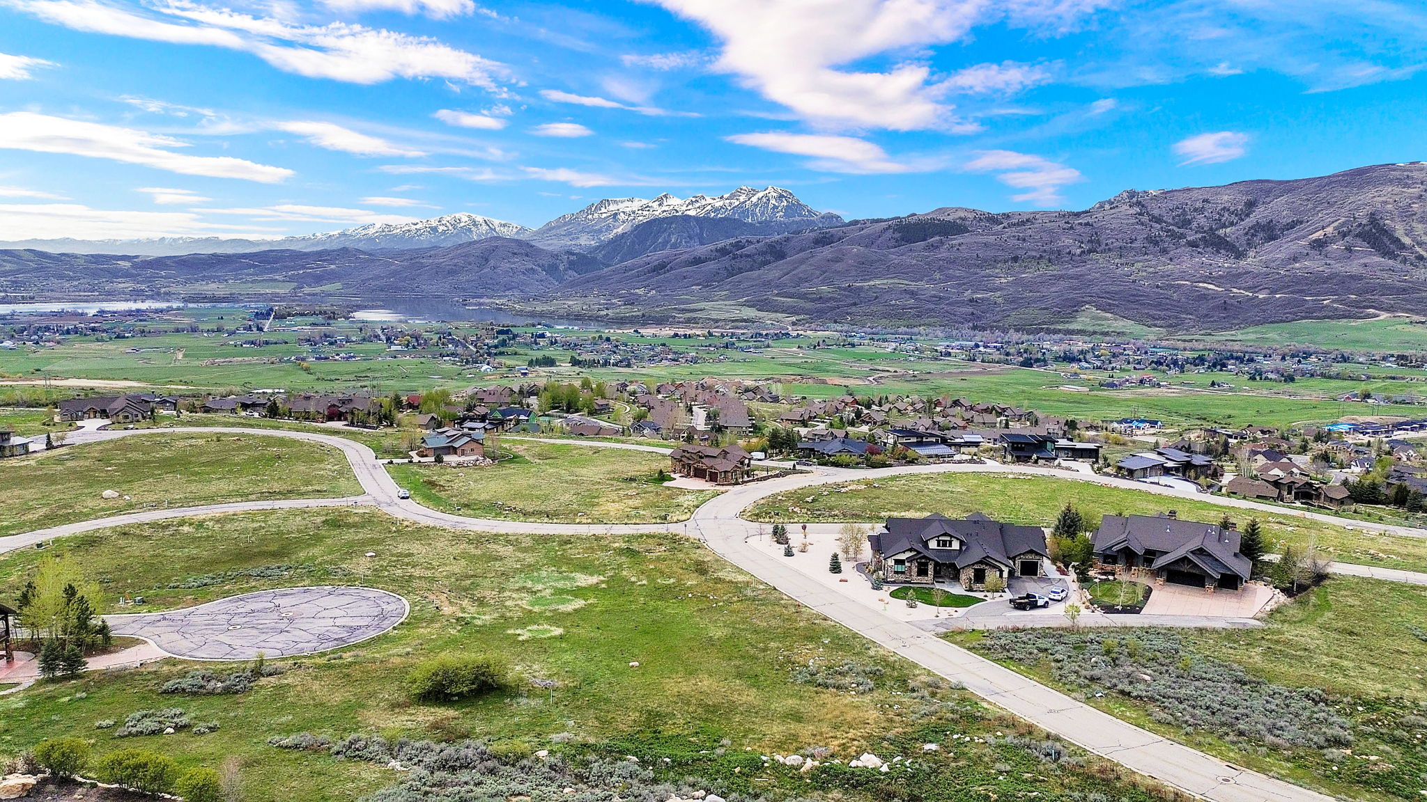 Aerial view of residential area featuring a mountain backdrop
