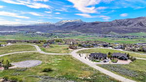 Aerial view of residential area featuring a mountain backdrop