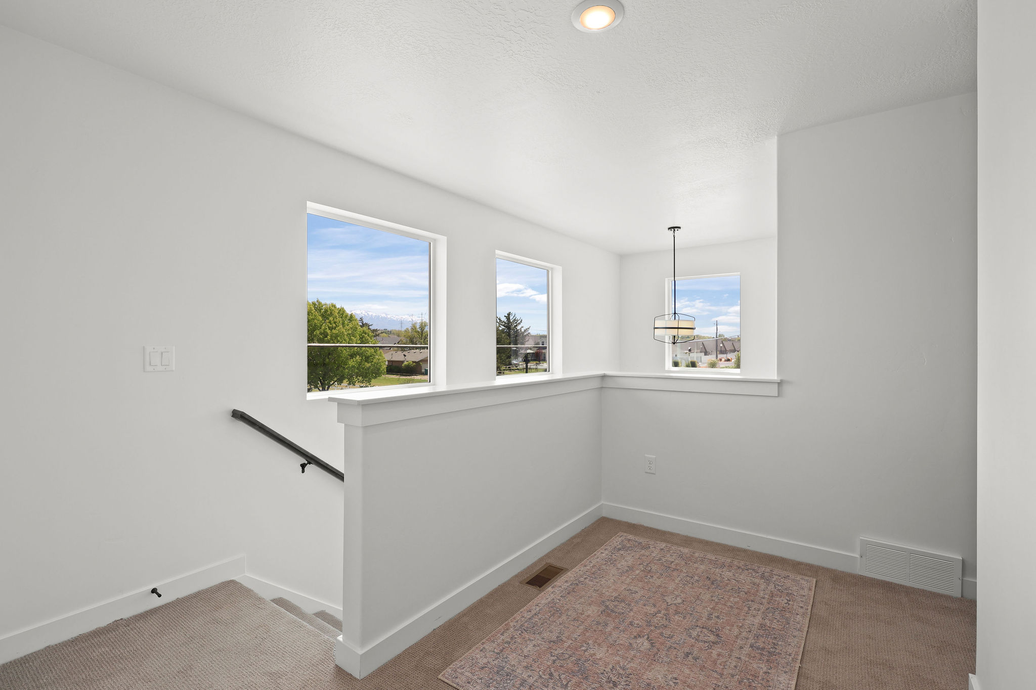 Staircase featuring carpet flooring and baseboards
