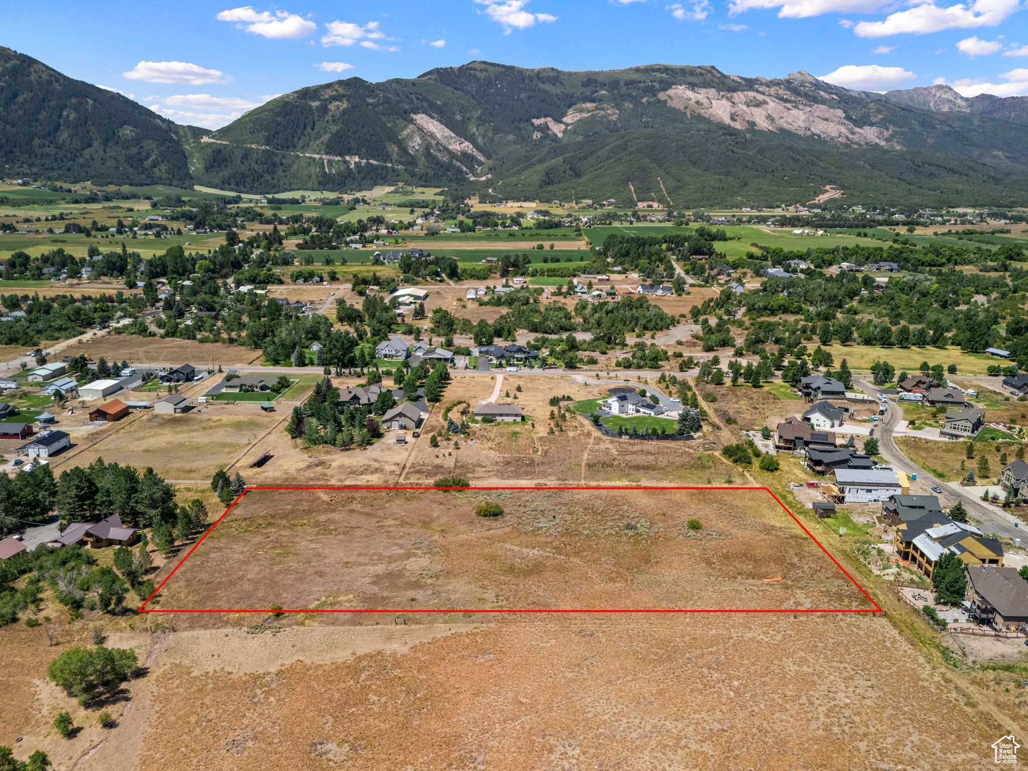 Aerial view of property's location with rural landscape and nearby suburban area