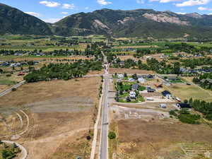 4100 N road has 2 small white cars at entrance of dirt road easement. The dirt road easement runs along side of home with green grass.Keep driving on dirt road to the property where you will find the Coldwell Banker sign & that's the property's location