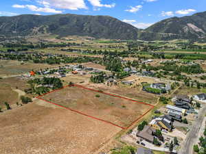Aerial overview of property's location with rural landscape.Red pin is the access road to the property
