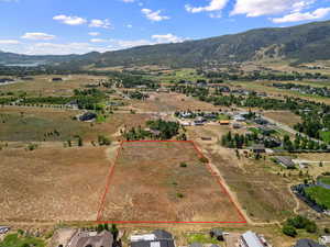 Aerial view of property's location featuring mountains and rural landscape
