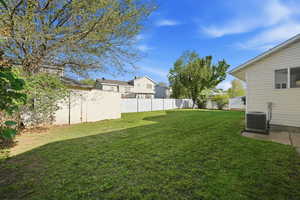 Fenced backyard with a residential view