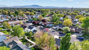 Aerial perspective of suburban area with a mountainous background