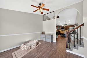Living room with a ceiling fan, dark wood-style floors, and recessed lighting