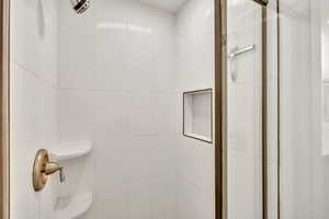 Bathroom featuring an updated stall shower