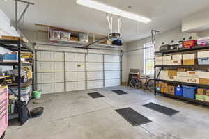 Garage featuring a garage door opener