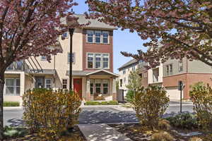 Traditional-style home with brick siding and roof with shingles