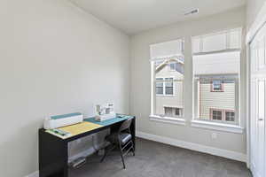 Office featuring carpet and baseboards