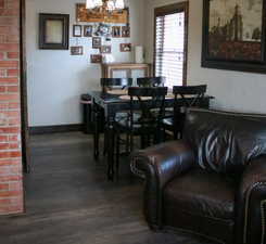 Dining space featuring a chandelier and wood finished floors