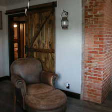 Sitting room with wood finished floors and baseboards