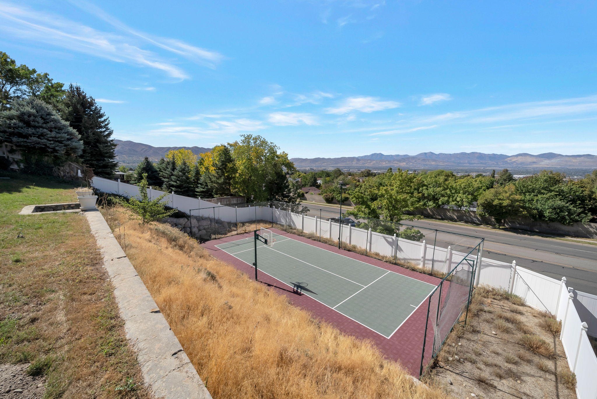 View of tennis court featuring a mountain view