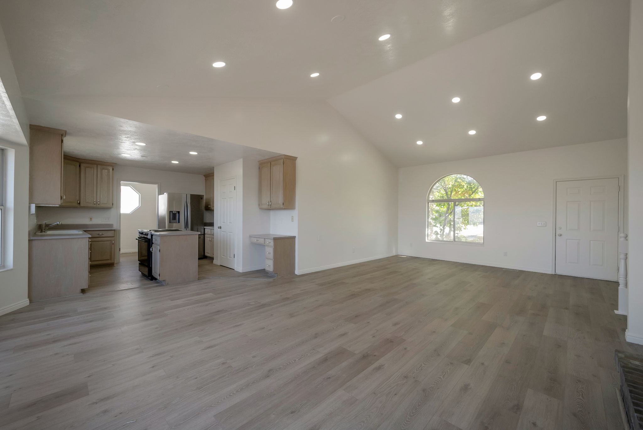 Unfurnished living room featuring light wood finished floors and recessed lighting