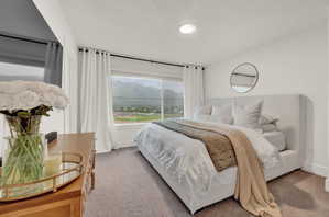 Bedroom with a mountain view and carpet floors
