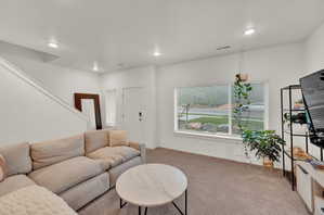 Living room with carpet and recessed lighting