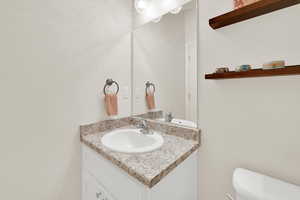 Bathroom with vanity and toilet