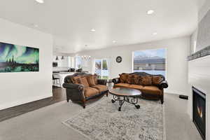 Living area with a chandelier and a large fireplace