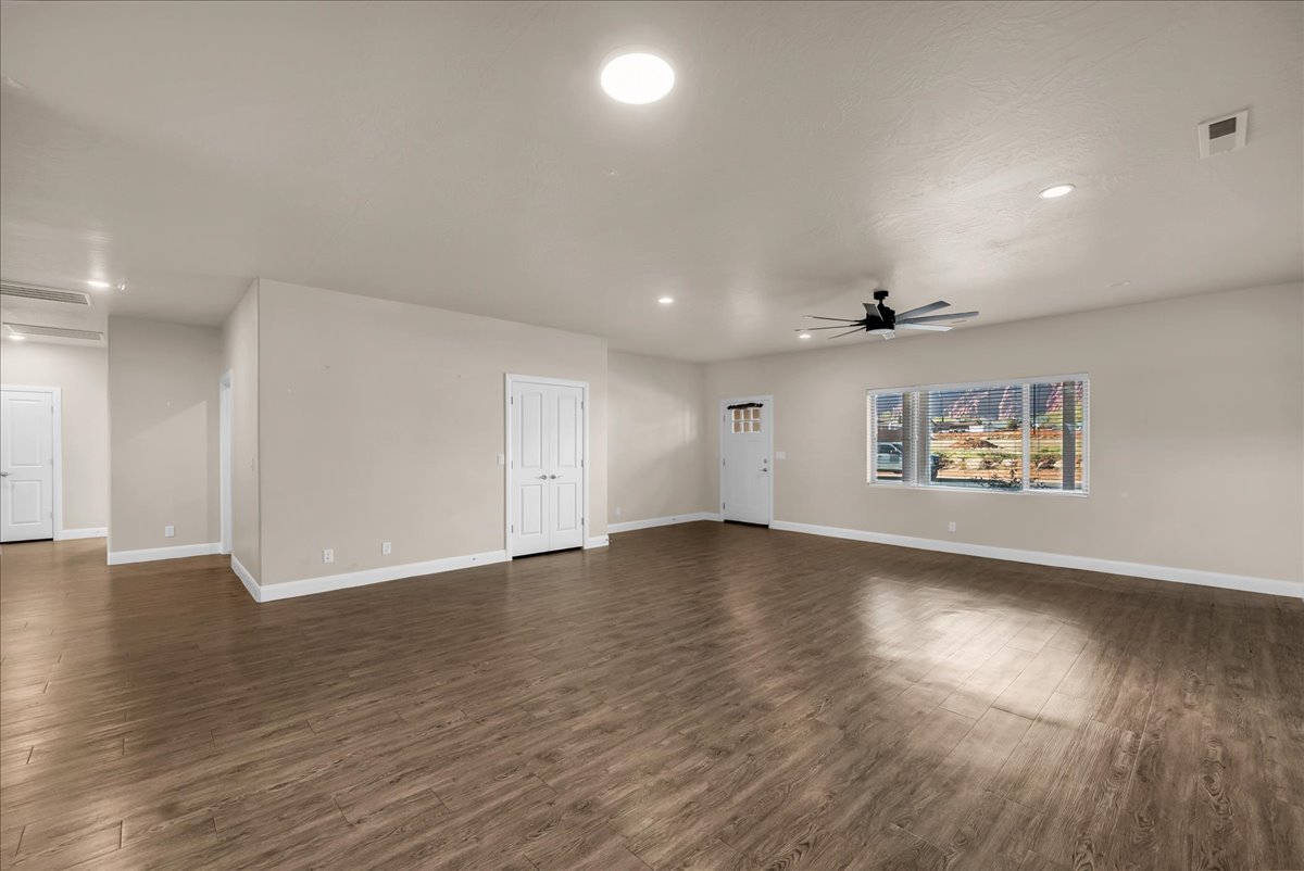 Spare room featuring dark wood finished floors, recessed lighting, and ceiling fan