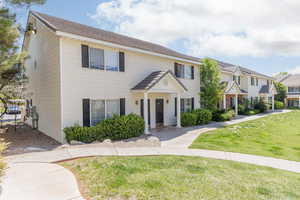 Colonial home with a front lawn