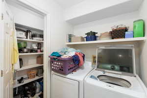 Laundry room featuring washing machine and clothes dryer