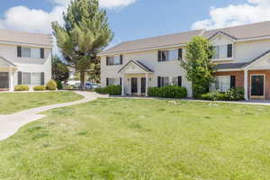 Colonial home with a front lawn