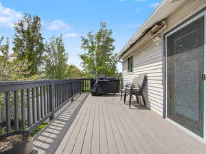 Wooden deck featuring grilling area