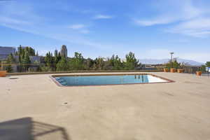 Community pool featuring a mountain view