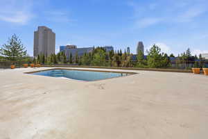 Community pool with a view of city