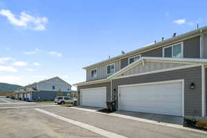 View of front of house featuring board and batten siding and a mountain view
