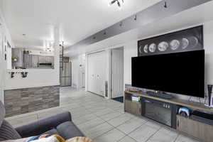 Living area featuring a textured ceiling