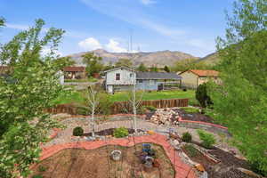 Fenced backyard with a mountain view and a residential view