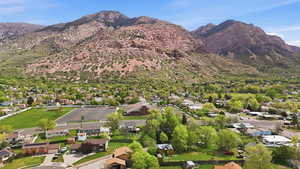 Aerial view of residential area featuring a mountainous background