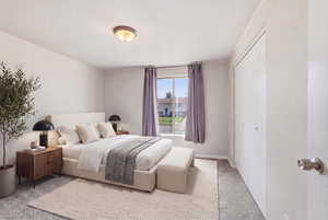 Bedroom featuring a closet and carpet floors