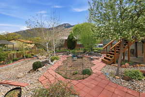 View of patio / terrace with stairway and a mountain view