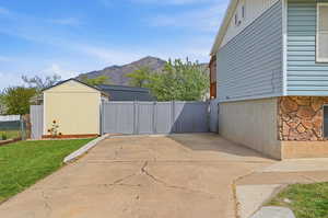 View of patio featuring a mountain view and a gate