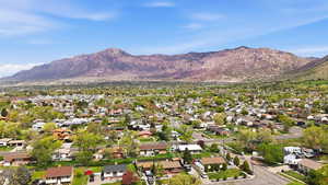 Aerial view of residential area featuring a mountain backdrop
