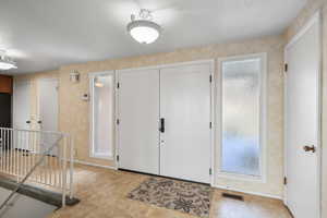 Entryway featuring baseboards