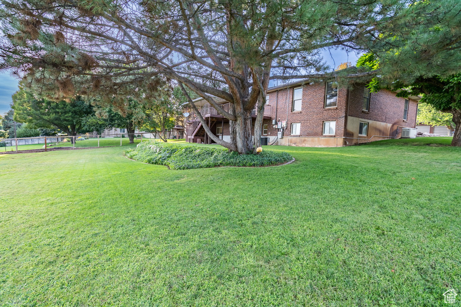 View of yard featuring a wooden deck