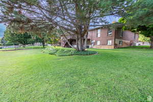 View of yard featuring a wooden deck