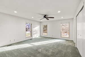 Unfurnished bedroom featuring carpet floors, a ceiling fan, and recessed lighting