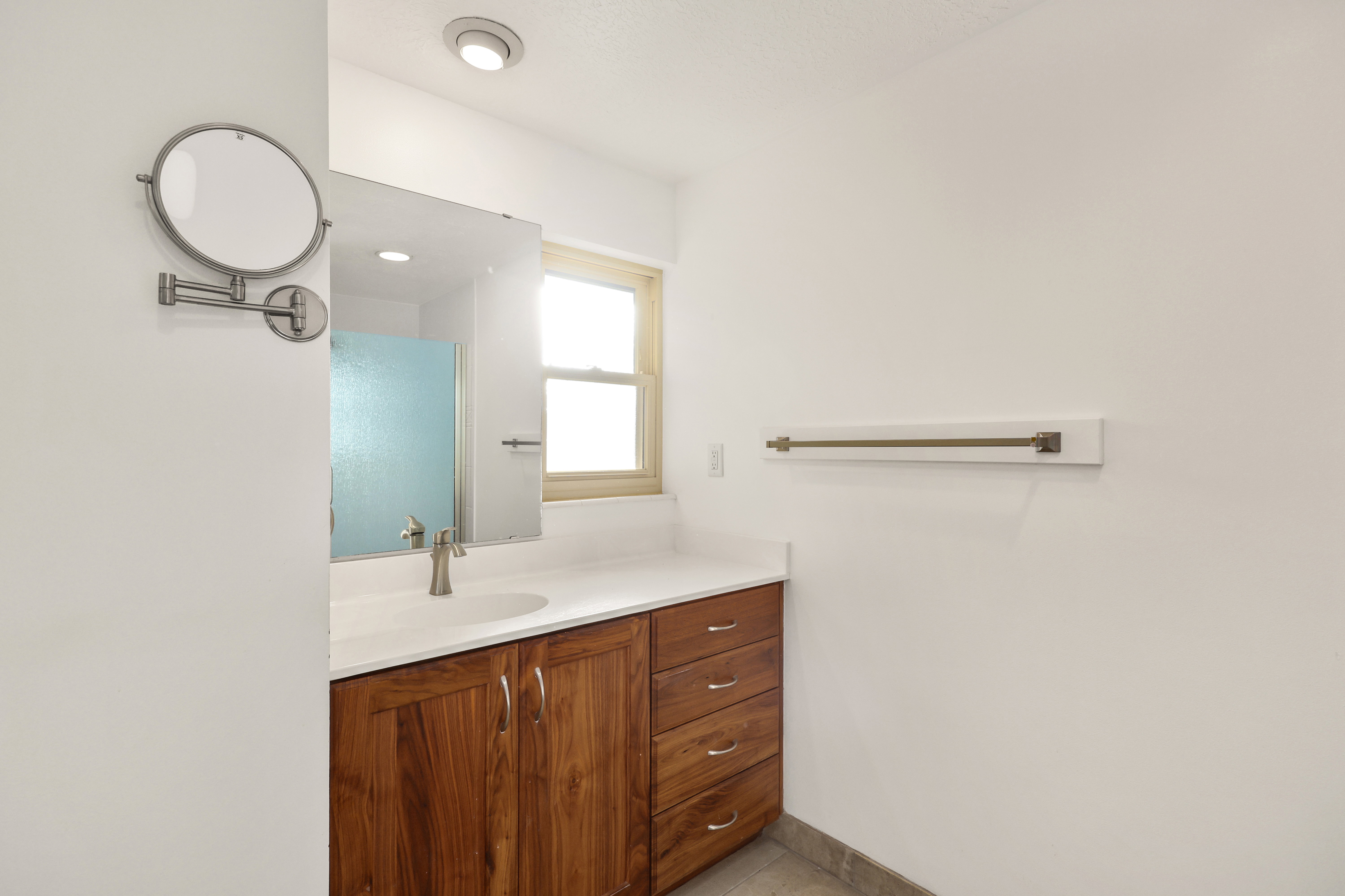 Bathroom with vanity and light tile patterned flooring
