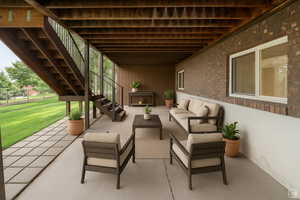 View of patio with stairs and outdoor seating