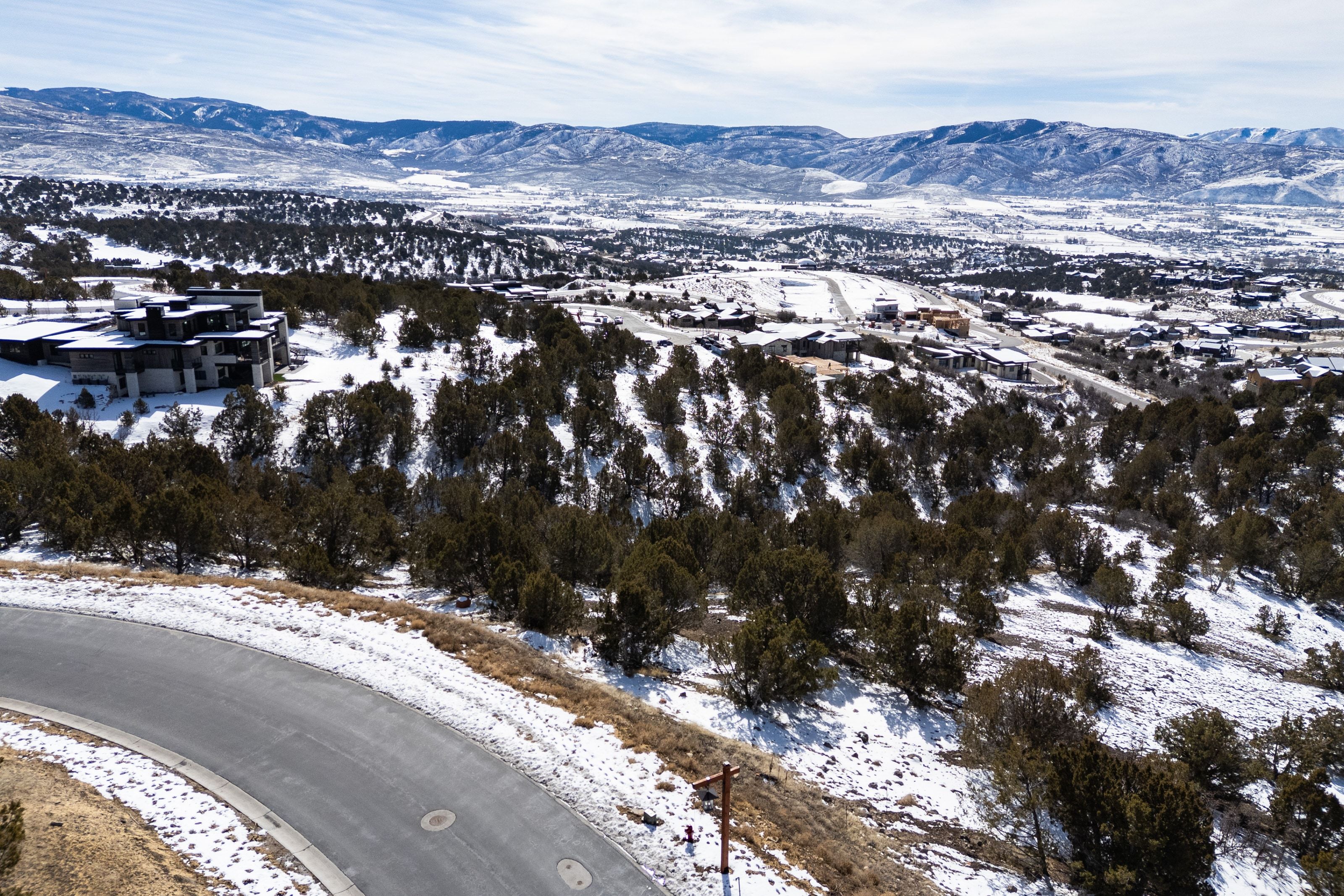Snowy aerial view featuring a mountain view