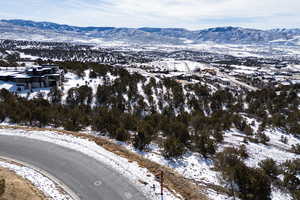 Snowy aerial view featuring a mountain view