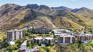 Drone / aerial view of mountains and apartment complex