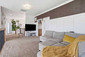 Living area with light carpet