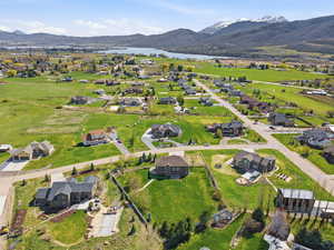View of property location with a water and mountain view and nearby suburban area