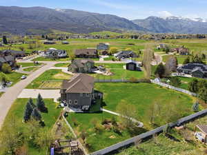 Aerial perspective of suburban area with a mountain backdrop