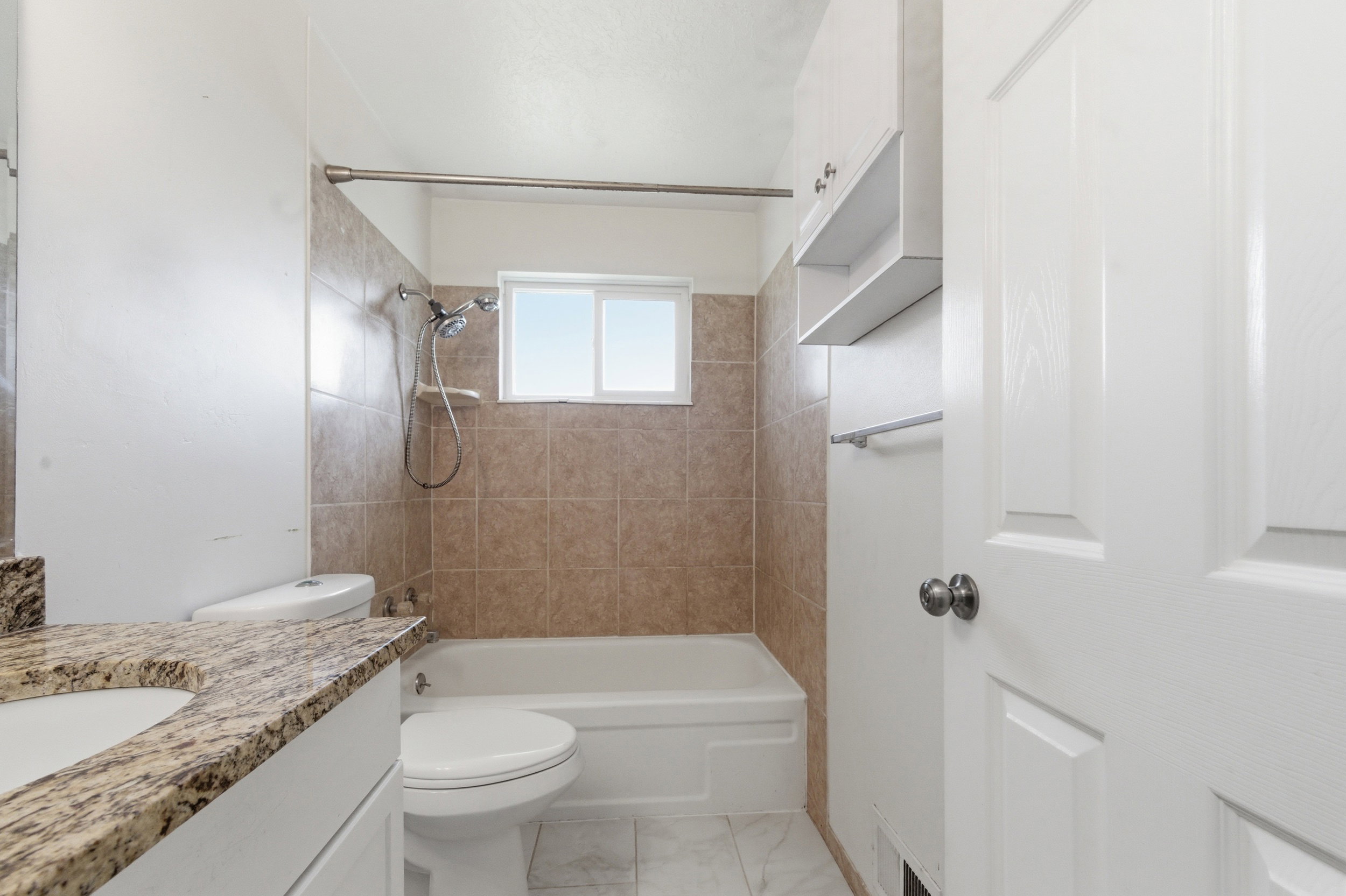 Full bath featuring vanity and tub / shower combination
